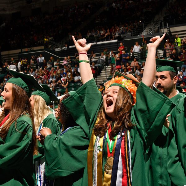 UNC Charlotte students cheer at Commencement