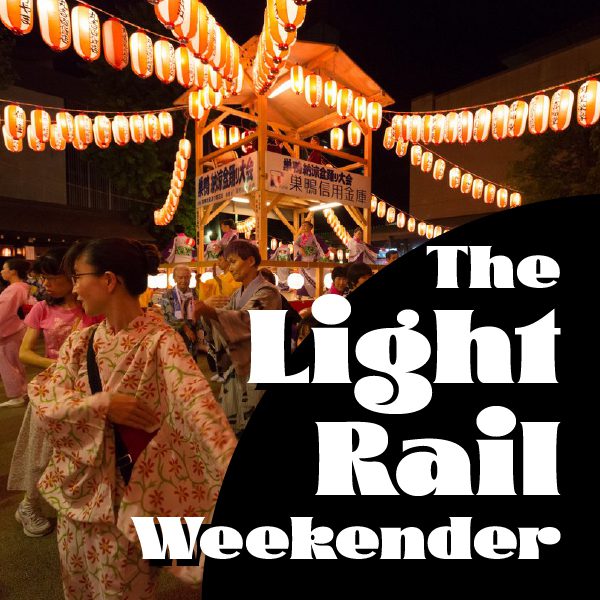 People wearing kimonos dance around structure with lanterns, bold text reads "The Light Rail Weekender"