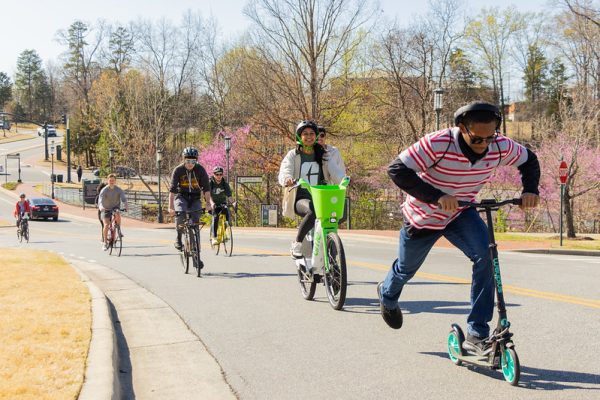 UNC Charlotte students ride bikes and scooters