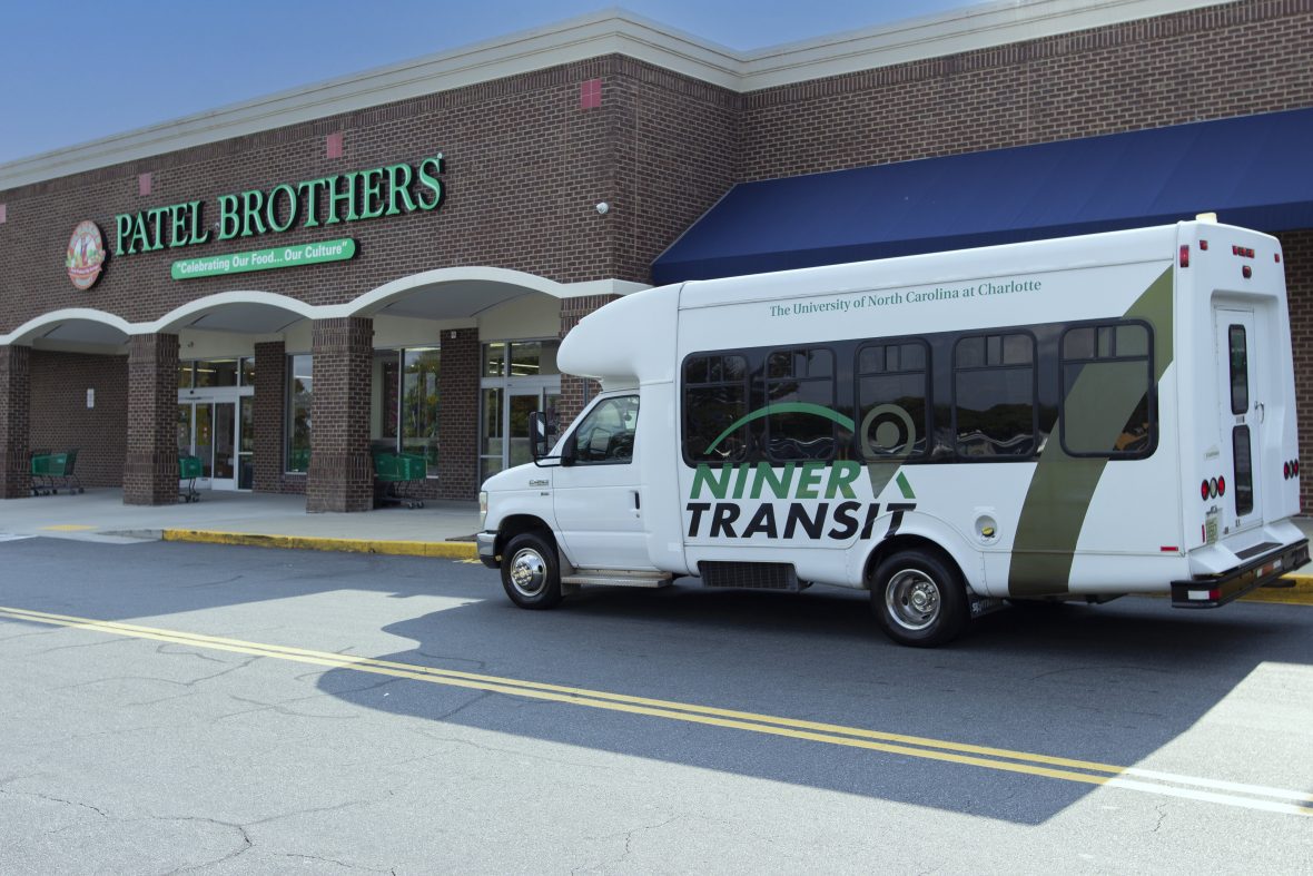 Shuttle bus parked in front of grocery store