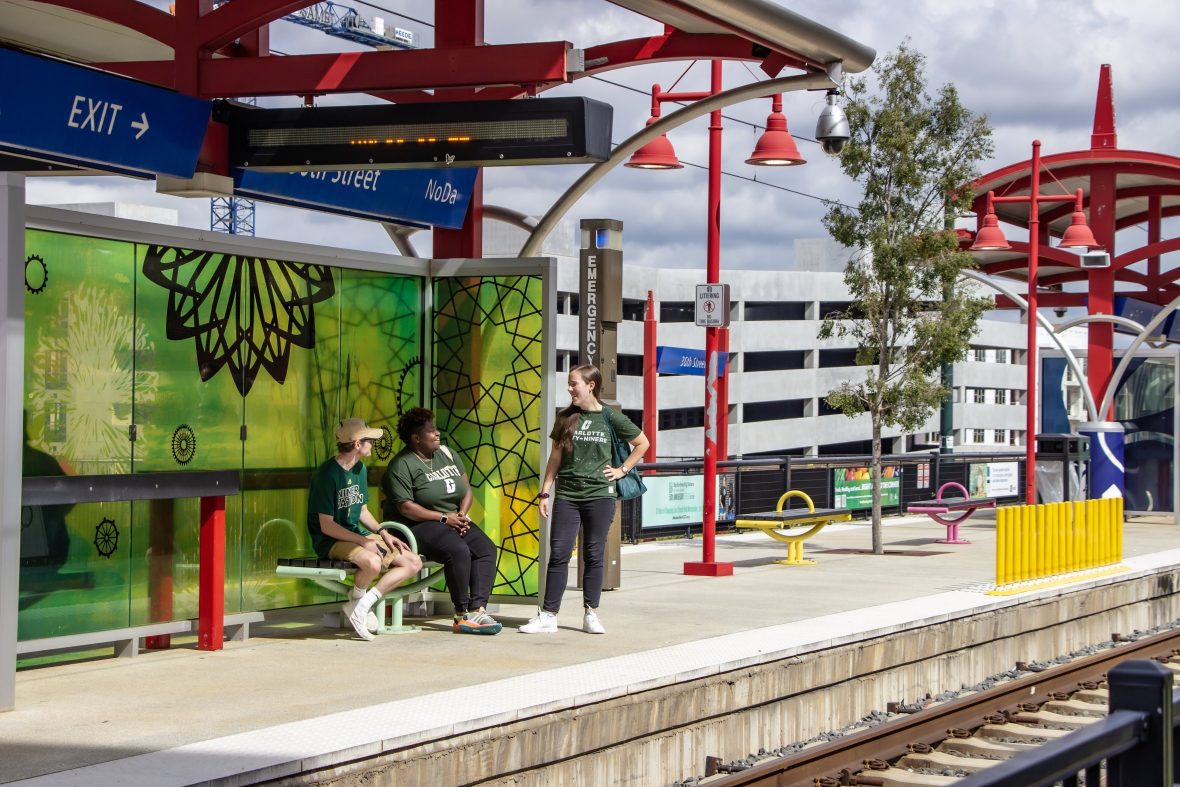 People waiting at a train stop