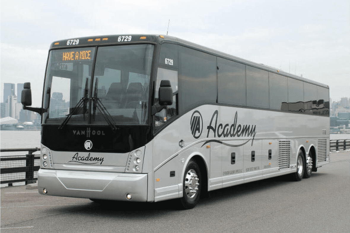 Full-sized motorcoach bus with the Academy logo on the side
