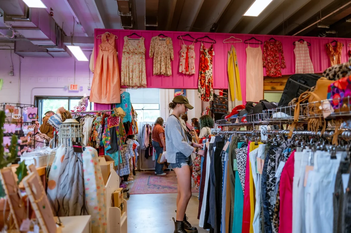 A girl shopping for clothes inside Thrift Pony