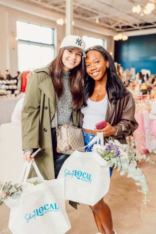 Two girls shopping at Just Us Girls Market