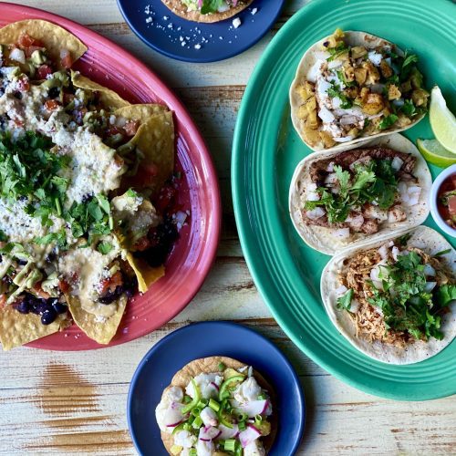 A plate of tacos on colorful plates