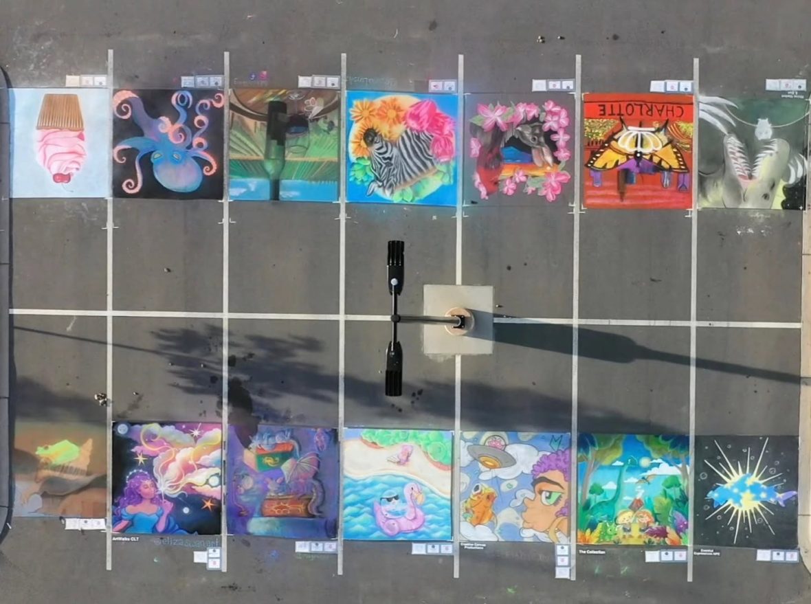 Artworks on parking spots from the Charlotte Chalk Art Festival.